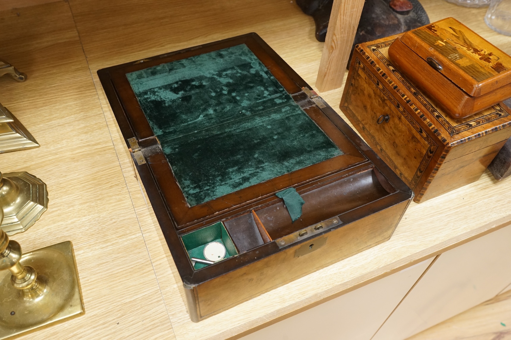 A walnut and German bandwork tea caddy, a brass bound walnut writing slope and an Art Deco Killarney inlaid trinket box, largest 15cm high, 30cm wide.